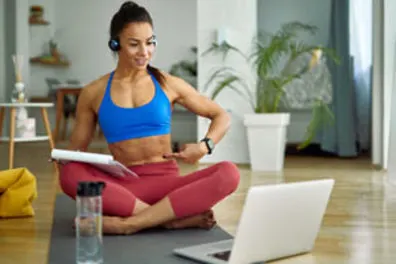 Online Coach teaching a class with a notepad in hand