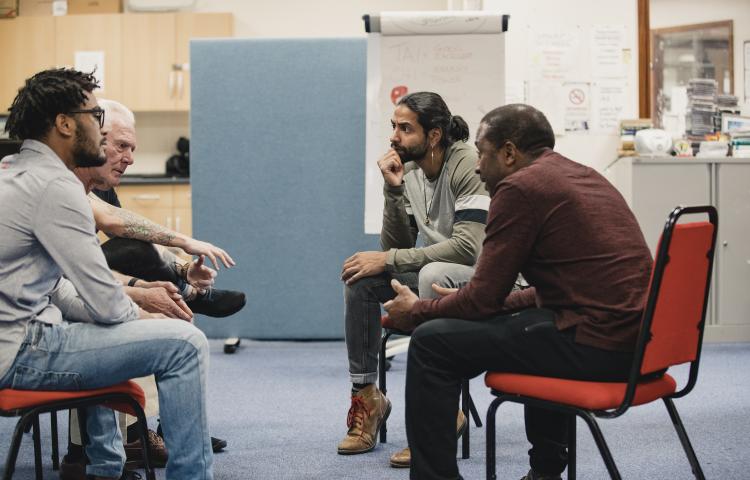 men talking in a support group
