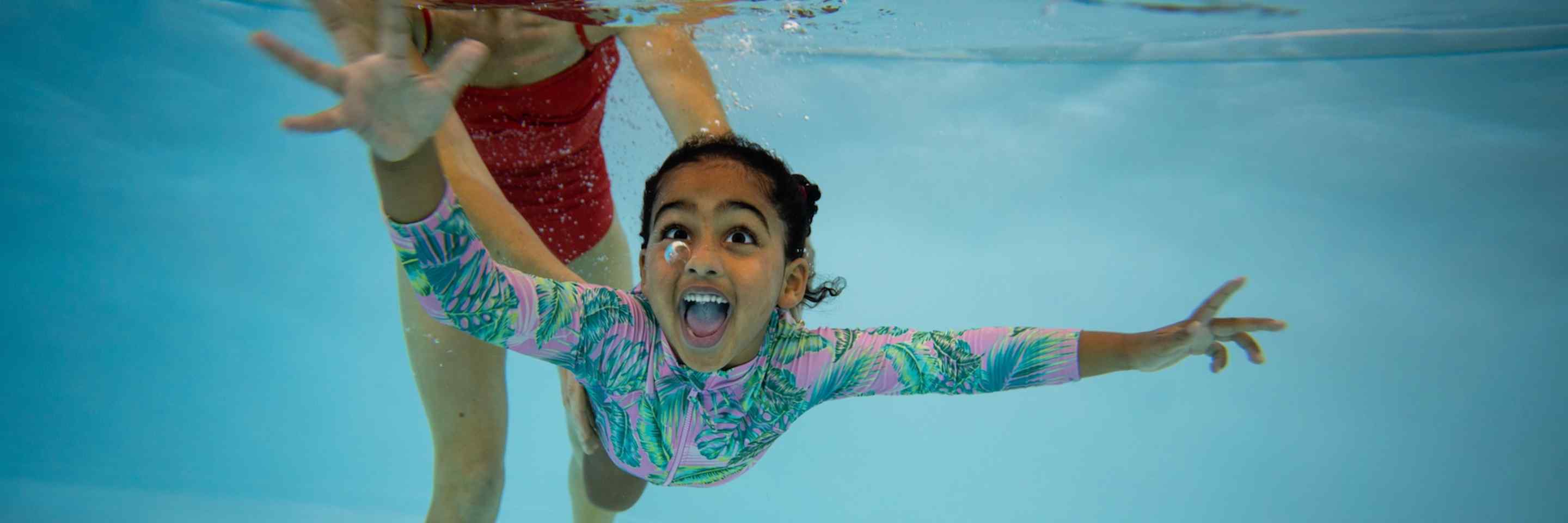 Child swimming in pool