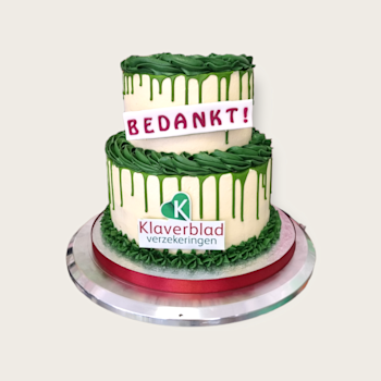 Een bedrijfstaart met drip, crème decoratie en logo naar wens. bedrijfstaart 2