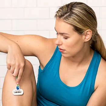 Woman shaving her leg