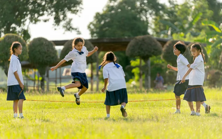 Schoolchildren playing outside at a regional school
