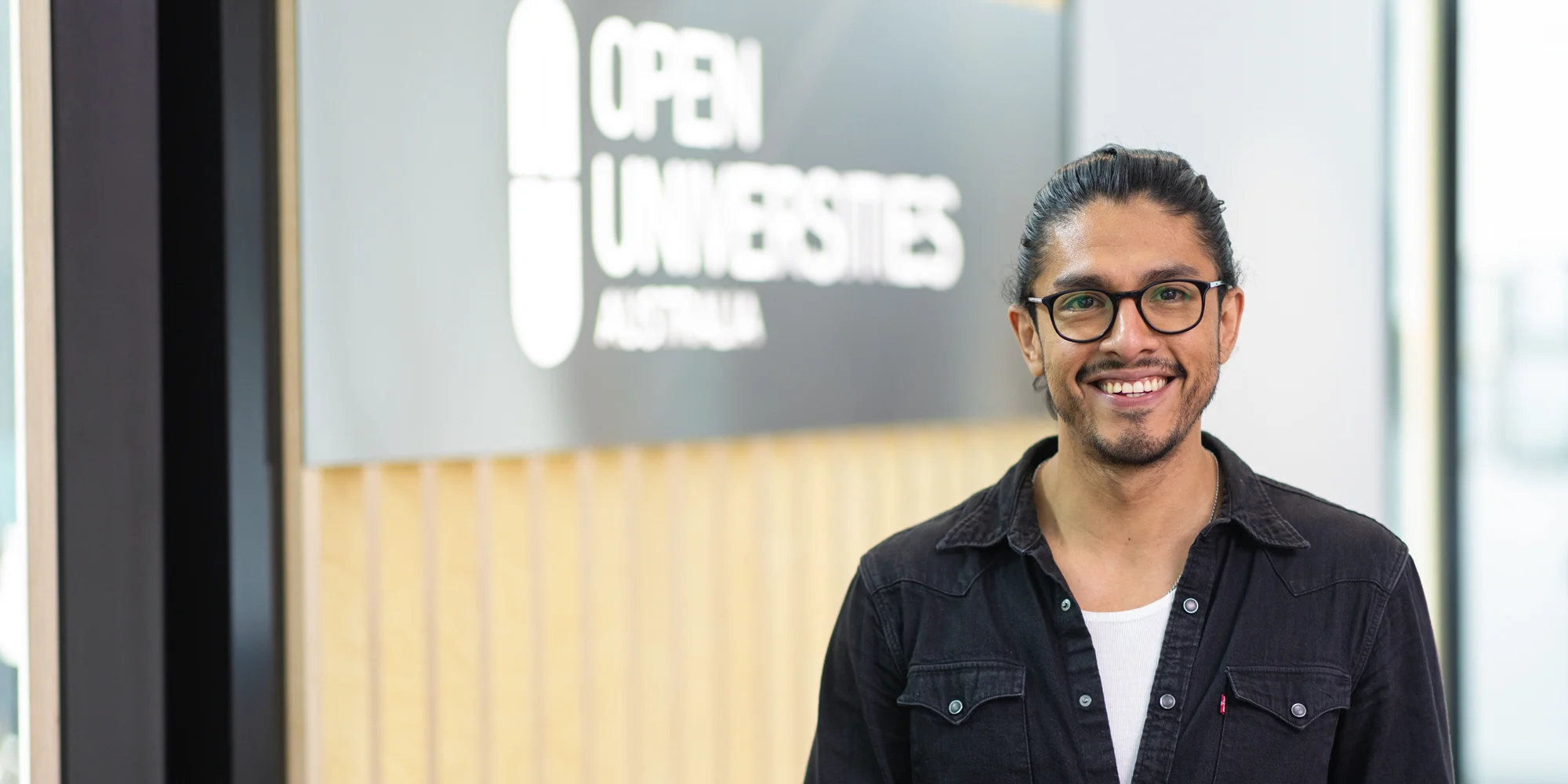 Friendly student advisor at OUA headquarters.