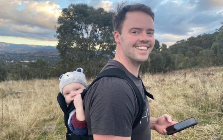 Charles enjoying his well-earned time off as a teacher, hiking with his baby in the mountains