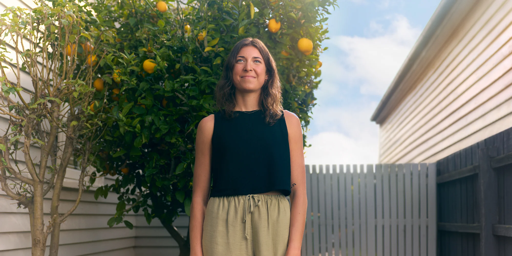 Student looking confident in her backyard.