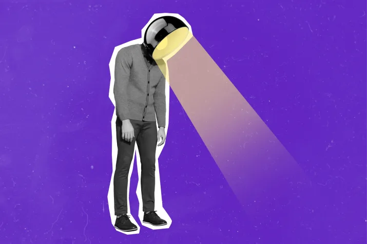 A slumped over man with a light as a head