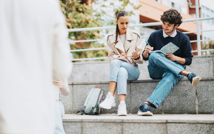 An early childhood graduate discussing her progress with her mentor