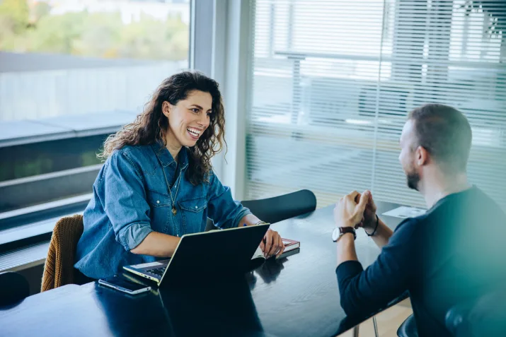 A recruiter chatting with a client
