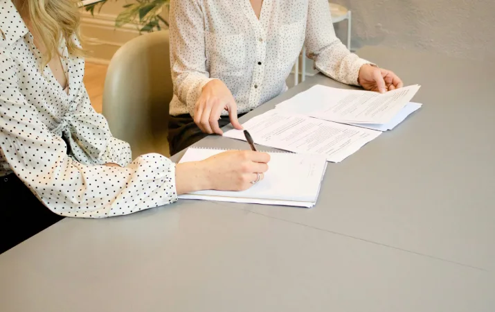 lawyers signing documents