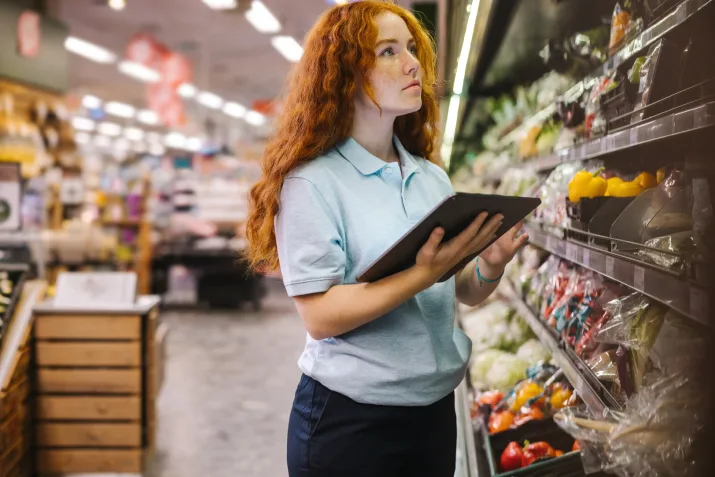 A woman working at a supermarket
