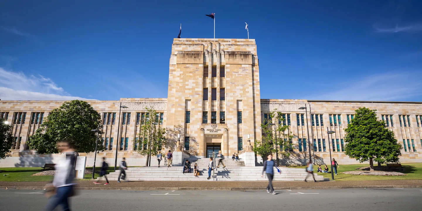 Students outside the Forgan Smith Building at The University of Queensland campus.