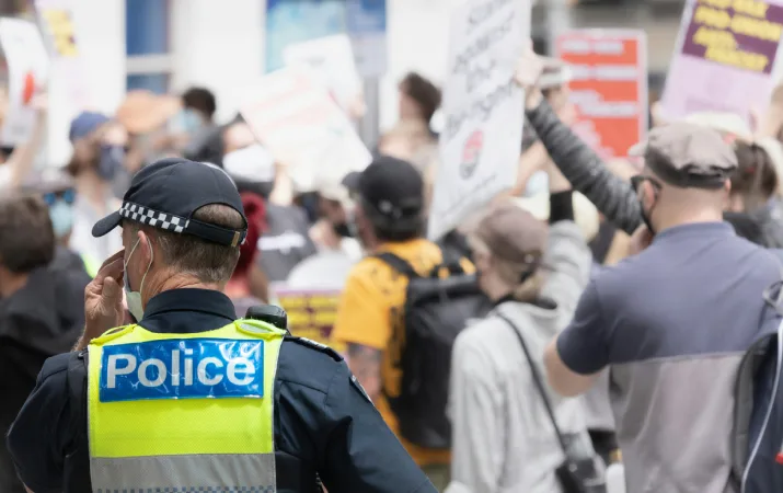 A police officer monitoring a protest