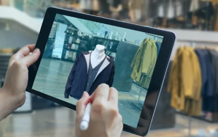 A fashion designer using 3D software to mock up a clothing design
