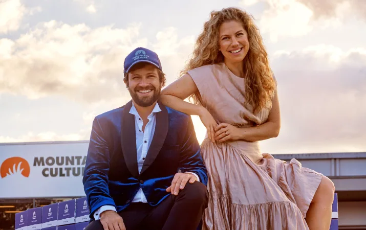 DJ and Harriet McCready posing on top of a car