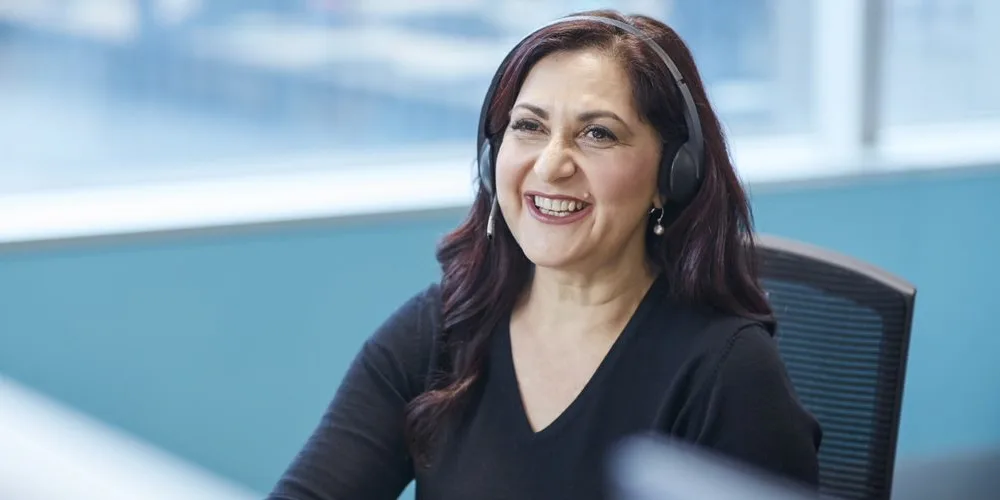 Smiling student advisor on a call