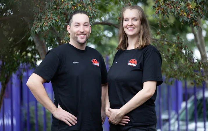 Annika and a colleague posing in front of The Little Kids Centre