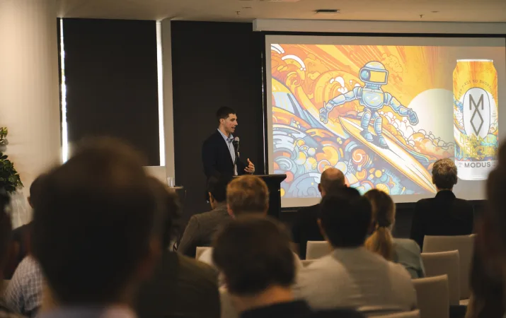 Jamie van Leeuwen sharing Absolutely AI's work with Modus Brewing