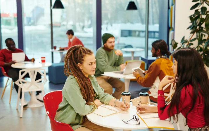 Teachers gathered in the staffroom between classes, discussing their salary and conditions
