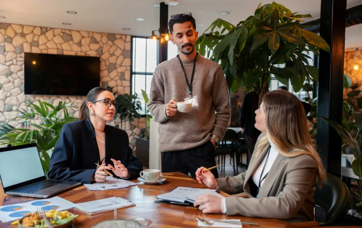 Three psychologists conferring over a meeting