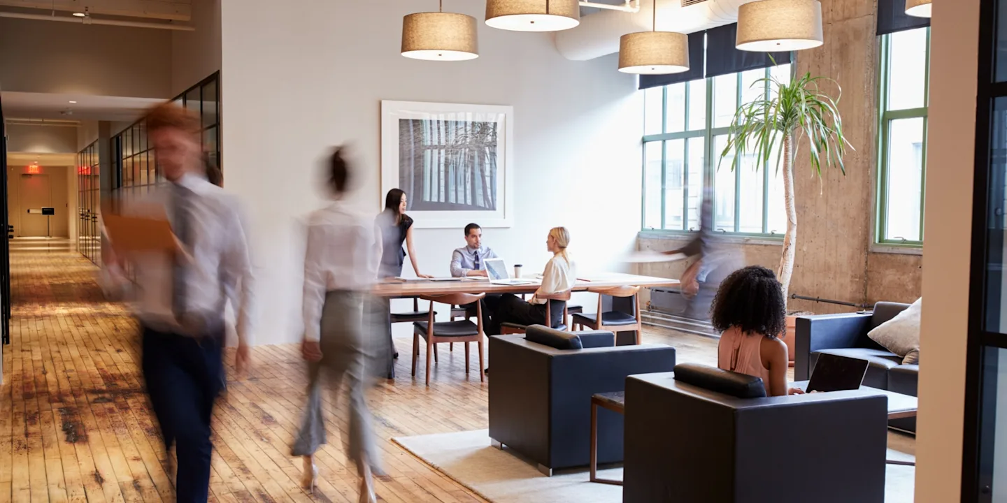 Business professionals collaborating in a bright and modern office building.