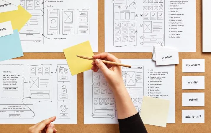 An accomplished UX designer working on website wireframe sketches