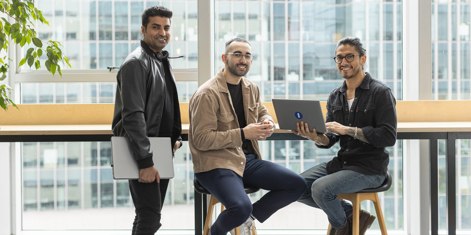 Three friendly experts at OUA headquarters