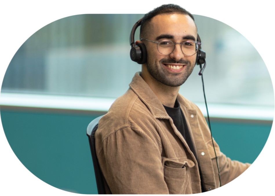 Open Universities Australia student advisor, Josh, seated at a workstation.