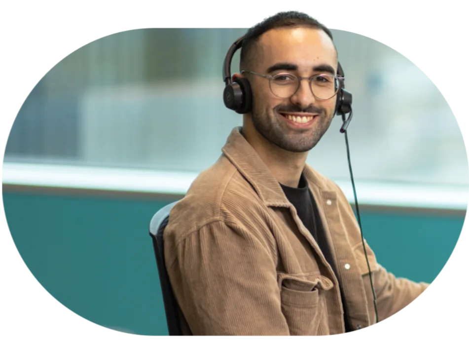 Open Universities Australia student advisor, Joshua, seated at a workstation.