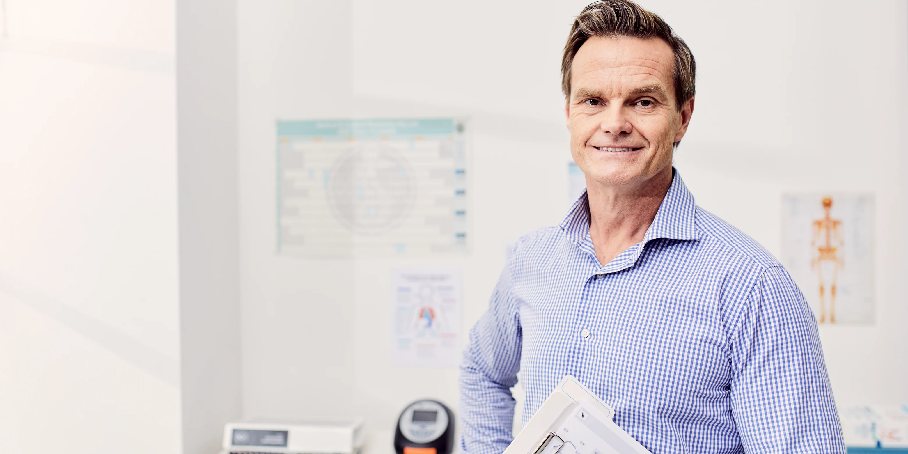Science student smiling in a modern laboratory.