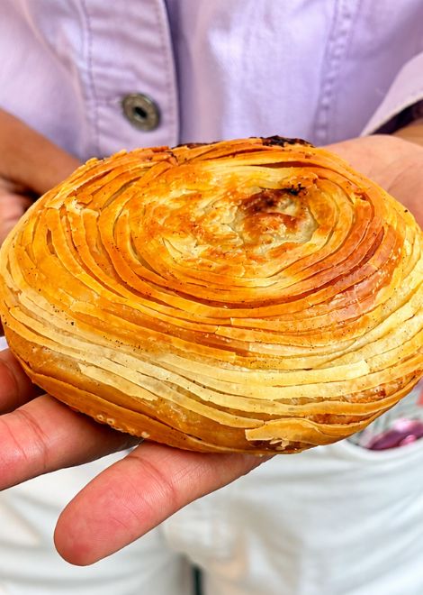 Flaky, spiral-layered beef pastry, crisp to the very last bite.