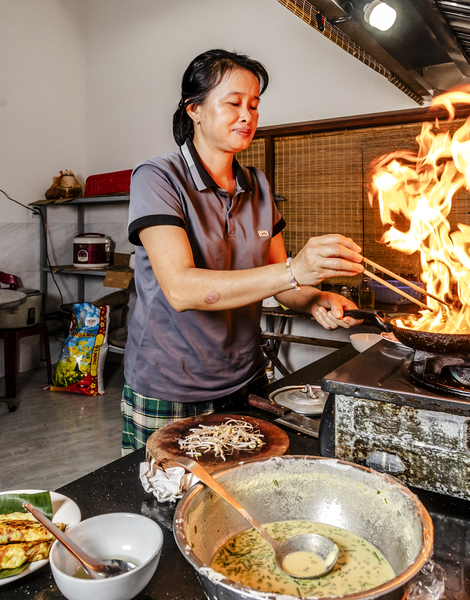 A fiery wok in a local kitchen