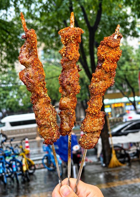 Cumin-dusted lamb skewers, hot off the grill.