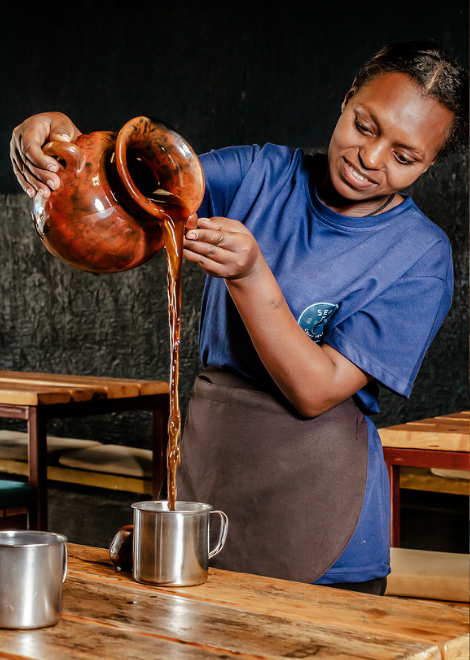Pouring local tellah 'beer'