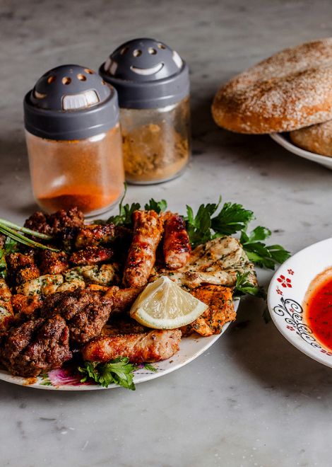 Mixed grilled brochettes with harissa and crusty khobz bread
