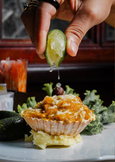 Creamy crab au gratin comes alive with a squeeze of lime
