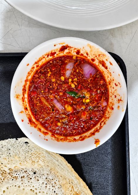 Fiery lunu miris sambol, bursting with chilli and sharp onion.