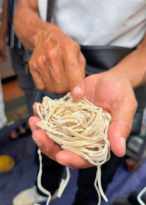 Handmade noodles, fresh from the market.