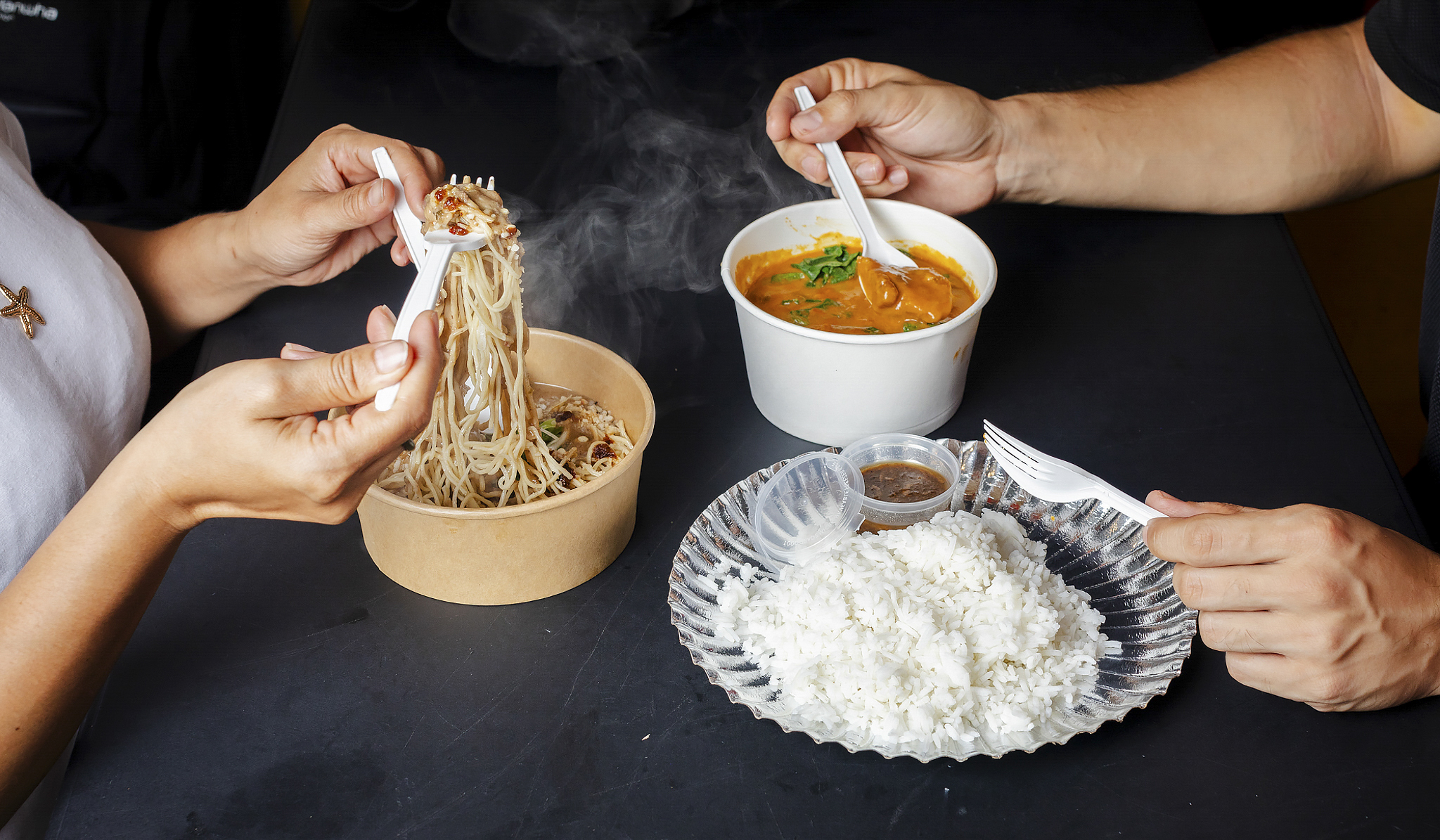 Steamy kare-kare stew and chilli peanut noodles