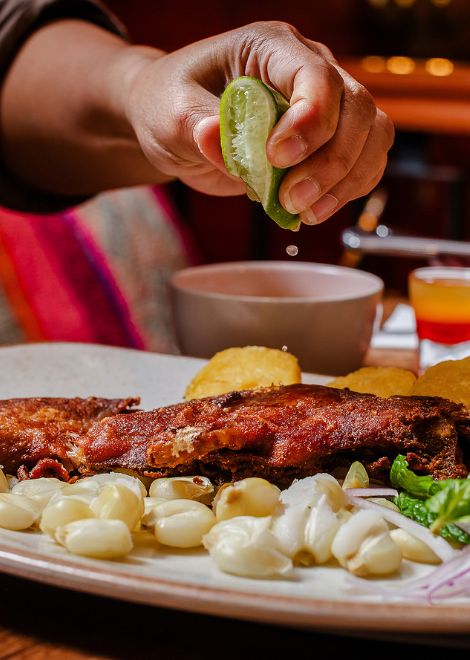 Roasted cuy served with hearty Andean corn soup offers a taste of one of the region's oldest culinary traditions