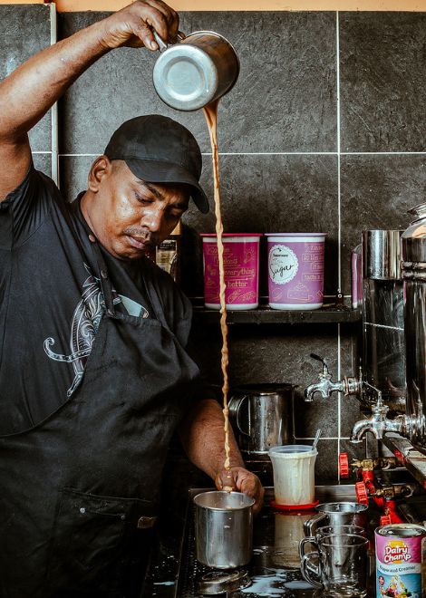 A theatrical high pour of rich, spice-infused Indian masala tea.