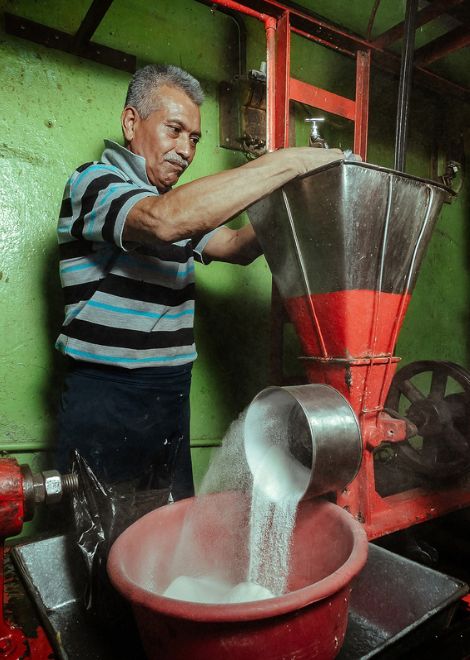 A traditional grinder at work. 