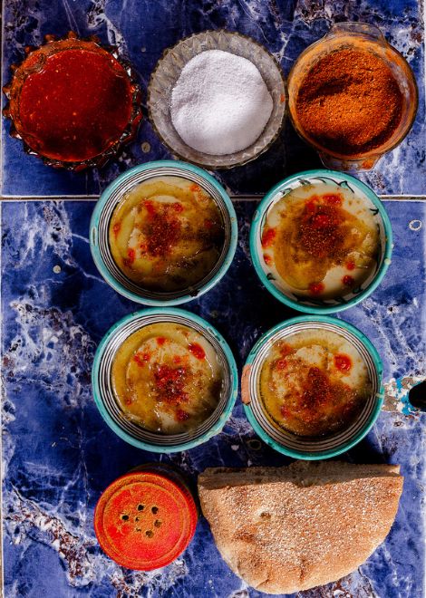 Bissara fava bean soup with khobz bread, olive oil, chilli and cumin