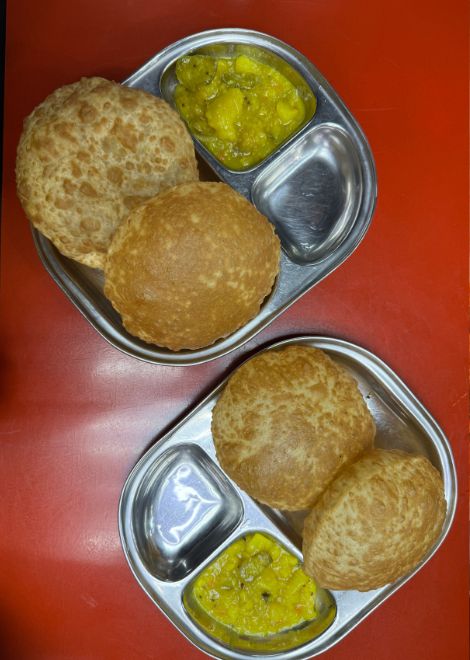Golden poori with warmly spiced potato masala.