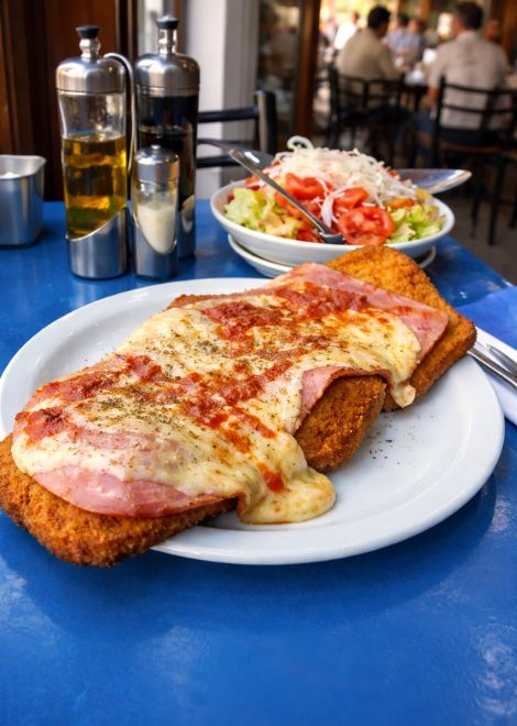 Milanesa napolitana breaded cutlet with mozzarella