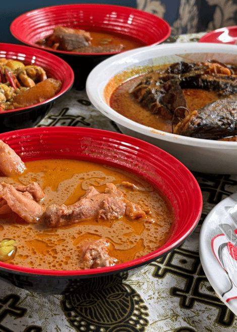 Rich nkate nkwan with tender chicken and roasted groundnuts.