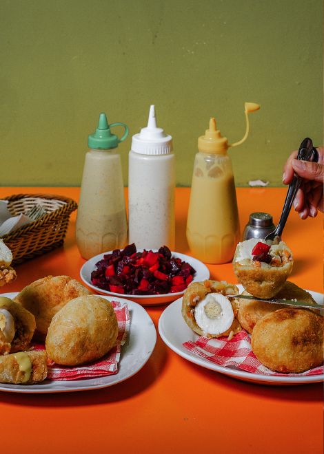 Seasoned meat wrapped in mashed potato and fried until golden