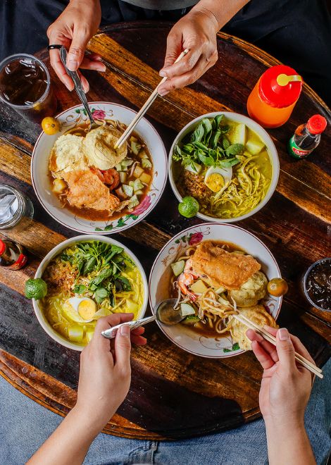 Fragrant bakmi Belitung in rich prawn broth alongside creamy chicken laksa.