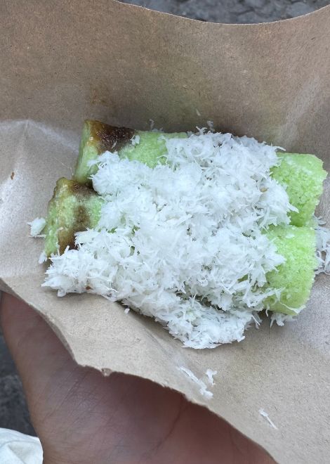 Warm kue putu, fragrant with pandan and filled with molten palm sugar.