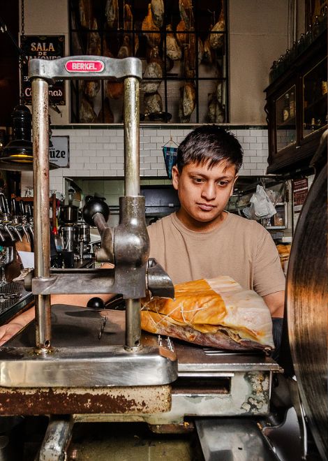 An old slicing machine, a well-aged ham, and years of practice