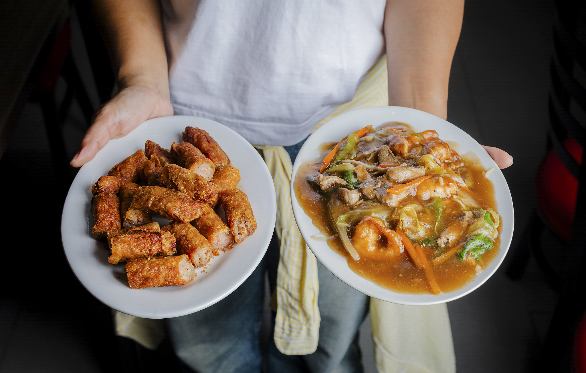 Serving fresh pancit noodles drenched in sauce